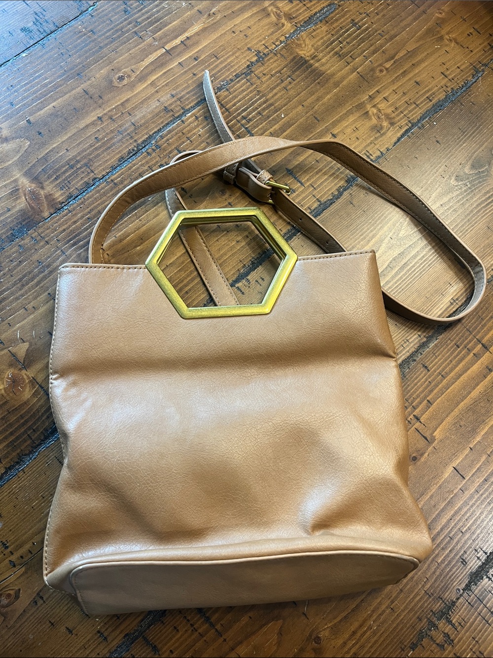Tan Leather Crossbody Bag with Gold Hexagon Accent.